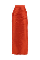 A vibrant tangerine maxi skirt from Aquarel Studio with flowing fabric and elegant design.