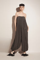 Black Valenciani jumpsuit with a sleek fit, featuring wide legs and a stylish neckline, perfect for modern, chic outfits.