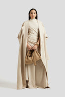 Deme By Gabriella Antonia three-piece beige co-ords outfit set featuring a top, trousers, and a matching jacket.