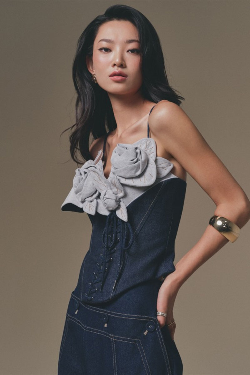 Keira Tong Petal Bustier Top featuring floral petal design and fitted style, displayed on a hanger against a neutral background.
