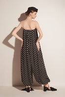 Black Valenciani jumpsuit with wide-leg design, featuring a sleeveless style and fitted waist, shown on a model.