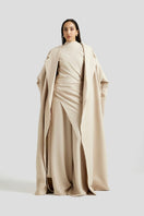 Deme By Gabriella Antonia three-piece beige co-ord set with matching top, pants, and cardigan on a mannequin.