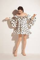 Valenciani white short ruffle mini dress with a voluminous skirt and layered ruffle details, perfect for summer occasions.