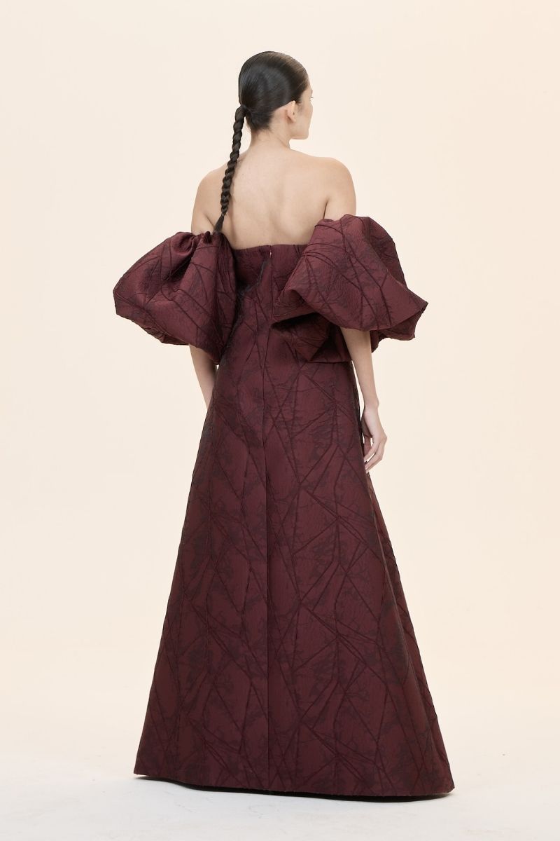 Nihan Peker Mustesna gown featuring elegant design, flowing fabric, and intricate details perfect for formal occasions.