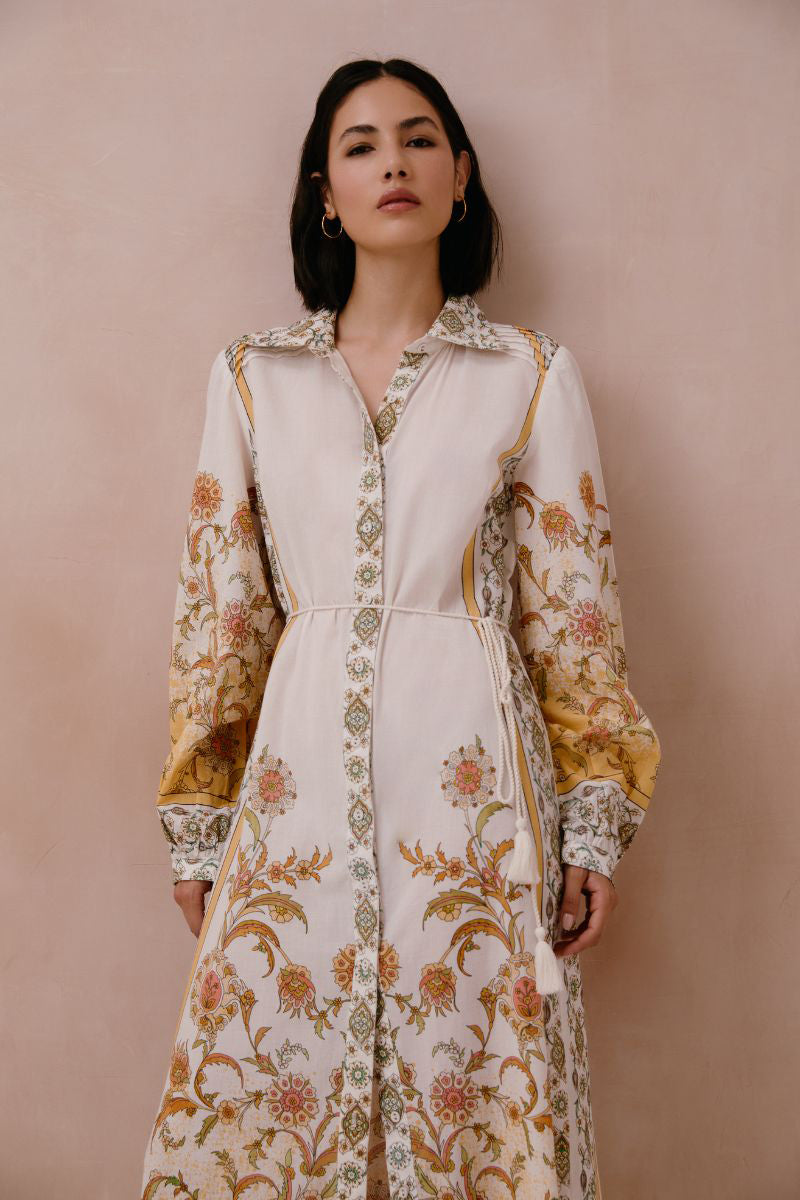 Yellow Briar midi dress by Raishma featuring a fitted bodice and flowing skirt, displayed on a mannequin.
