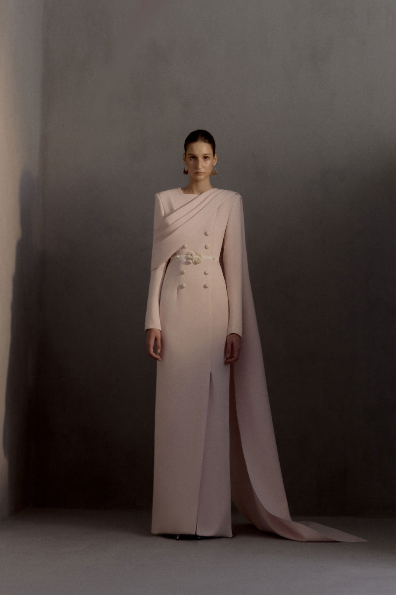White Plan Miranda gown with elegant design, featuring flowing fabric and intricate details perfect for formal occasions.