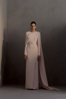 White Plan Miranda gown with elegant design, featuring flowing fabric and intricate details perfect for formal occasions.