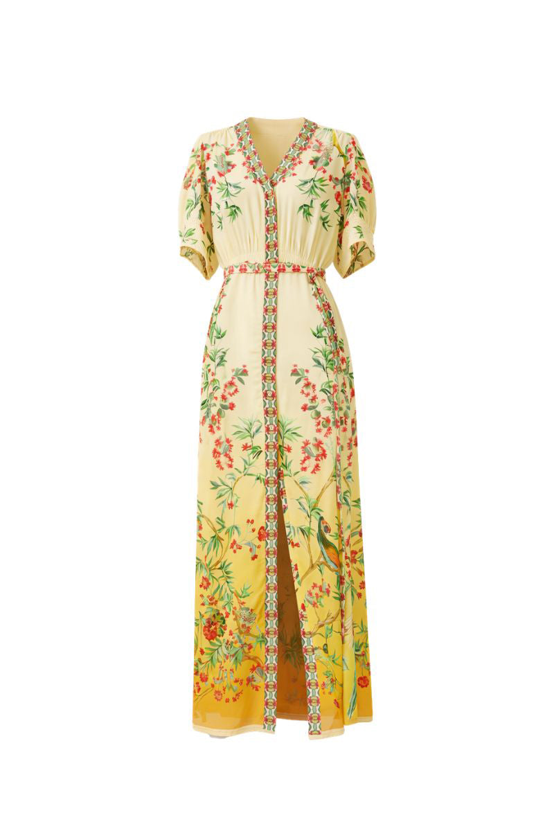 Raishma IVANNA midi dress with elegant floral pattern, fitted waist, and flowing fabric, displayed on a hanger.