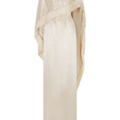 Cream Valenciani column gown with fringed trim cape, featuring elegant draping and intricate detailing for formal occasions.
