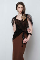 Do Long Urban Muse gown featuring a stylish, elegant design with flowing fabric and intricate details.
