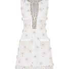 Valenciani mini lace dress with floral appliqué, featuring delicate lace fabric and a stylish, feminine design.