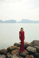 Red glitter stretch gown by Lune De Soie featuring a fitted silhouette and elegant design for formal occasions.