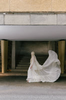 White Plan Antonia gown, elegant long dress with flowy fabric and intricate details, perfect for formal occasions.