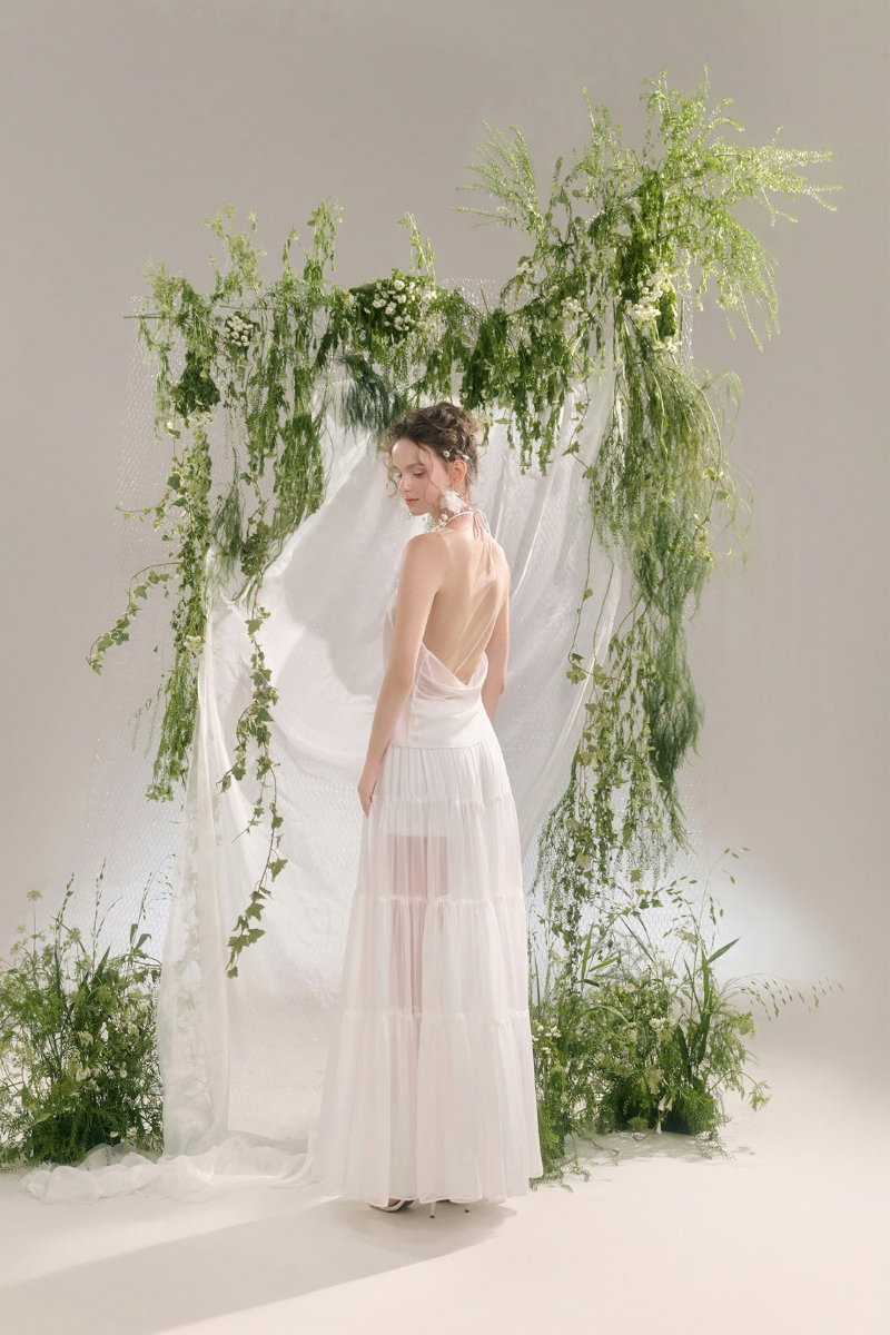 Arti Apparel VIOREIN MAXI SKIRT in flowing fabric, full-length design, styled with a high waist and elegant silhouette.