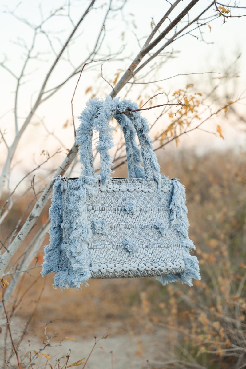 Bani medium Poka Balay top handle bag with structured design, beige color, and stylish handles on a plain background.