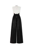 Black POEM AETHER trousers shown on a model, featuring a sleek, modern design with tailored fit and stylish detailing.