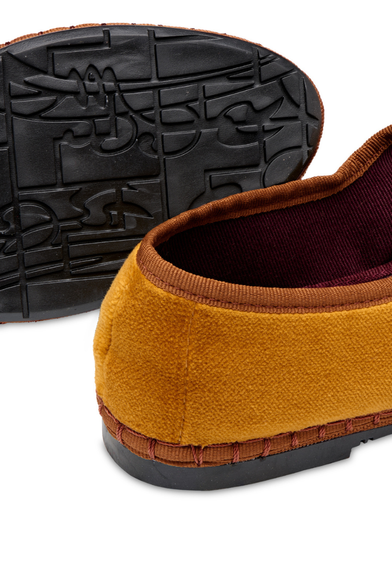 Flabelus Amaranta mustard flats with light brown piping, stylish slip-on shoes for women featuring a sleek design and comfortable fit.