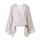 Leica gentle long sleeve shirt in ivory, featuring a soft fabric and classic fit, displayed on a hanger.