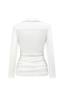 White JEMMIA top from Arti Apparel, stylish women’s blouse with a comfortable fit, shown on a model.