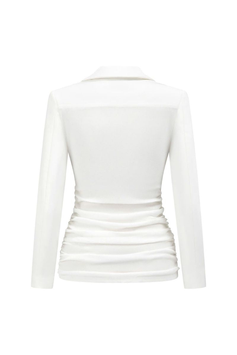 White JEMMIA top from Arti Apparel, stylish women’s blouse with a comfortable fit, shown on a model.