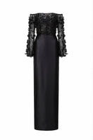 Black Yvette tulle and royal taffeta gown by 21Six, showcasing a flowing, elegant formal dress with intricate fabric details.
