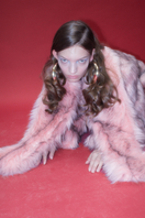 Sudi Etuz faux fur jacket with attached scarf, showing plush texture and stylish design, ideal for cold weather wear.