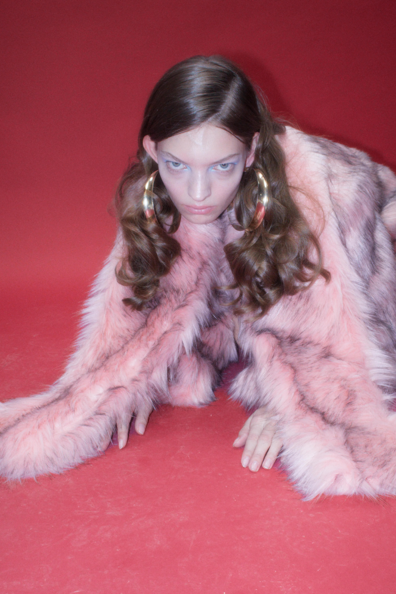 Sudi Etuz faux fur jacket with attached scarf, showing plush texture and stylish design, ideal for cold weather wear.