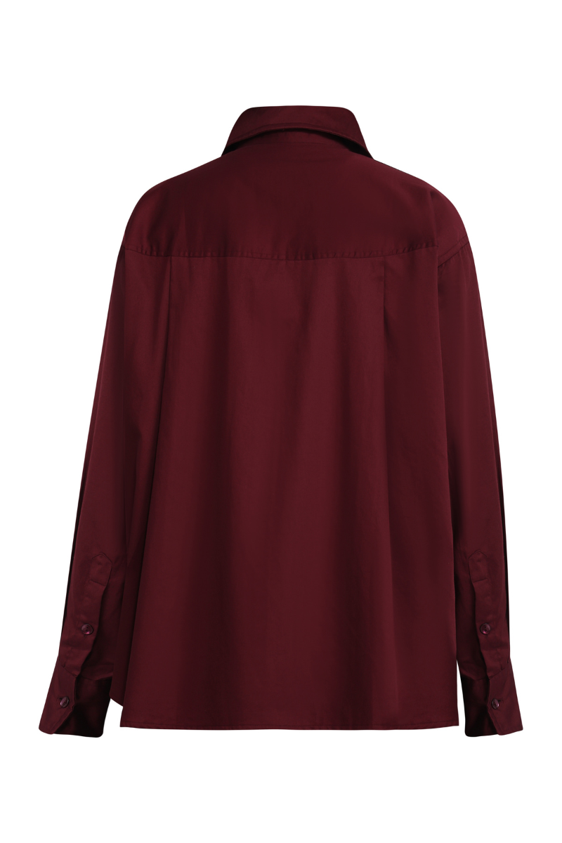 Summer Away Ravenna shirt in mulberry fabric with a relaxed fit and long sleeves, displayed on a hanger.