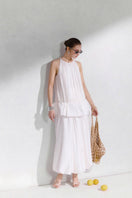 Arti Apparel Moneta Midi Skirt in soft fabric with a flowy, knee-length design and subtle pattern.