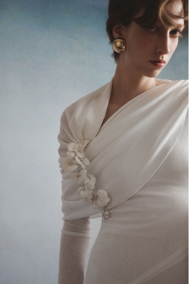 White Plan Celeste draped maxi dress featuring flowing fabric and elegant design, perfect for formal or casual occasions.