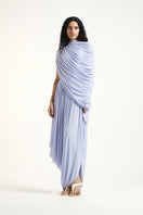 Deme By Gabriella Kyra Maxi Dress in periwinkle color, flowing fabric with a stylish design, displayed on a hanger.
