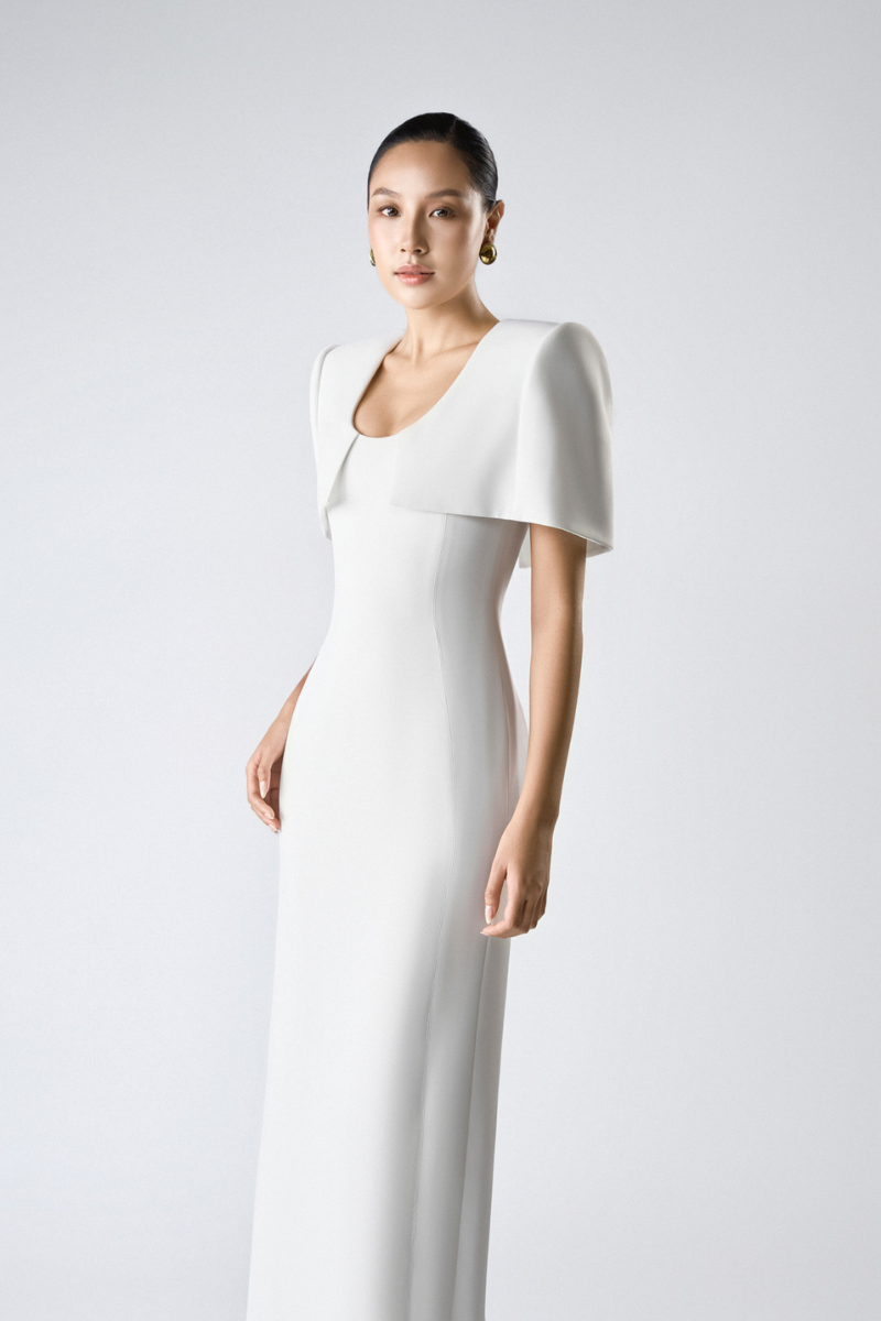 Elegant SILKEN WHISPER gown by TONYY, flowing fabric with delicate details, perfect for formal occasions or evening wear.