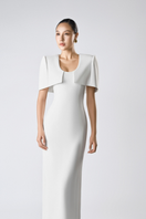 Elegant SILKEN WHISPER gown by TONYY, featuring flowing fabric and intricate details, perfect for formal occasions.