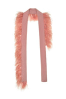 Hand knitted pink embellished scarf by Lalo with intricate details and soft texture, perfect for stylish winter accessories.