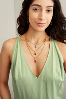 Ben Amun Zinnia Necklace featuring intricate floral design and gold-tone finish, displayed on a neutral background.