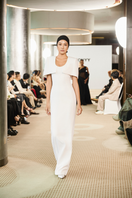 Elegant SILKEN WHISPER GOWN by TONYY, featuring flowing fabric and a graceful design, perfect for formal occasions.