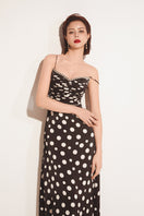 Black Valenciani sweetheart neck spaghetti strap maxi dress with flowing fabric and a fitted bodice, perfect for elegant occasions.