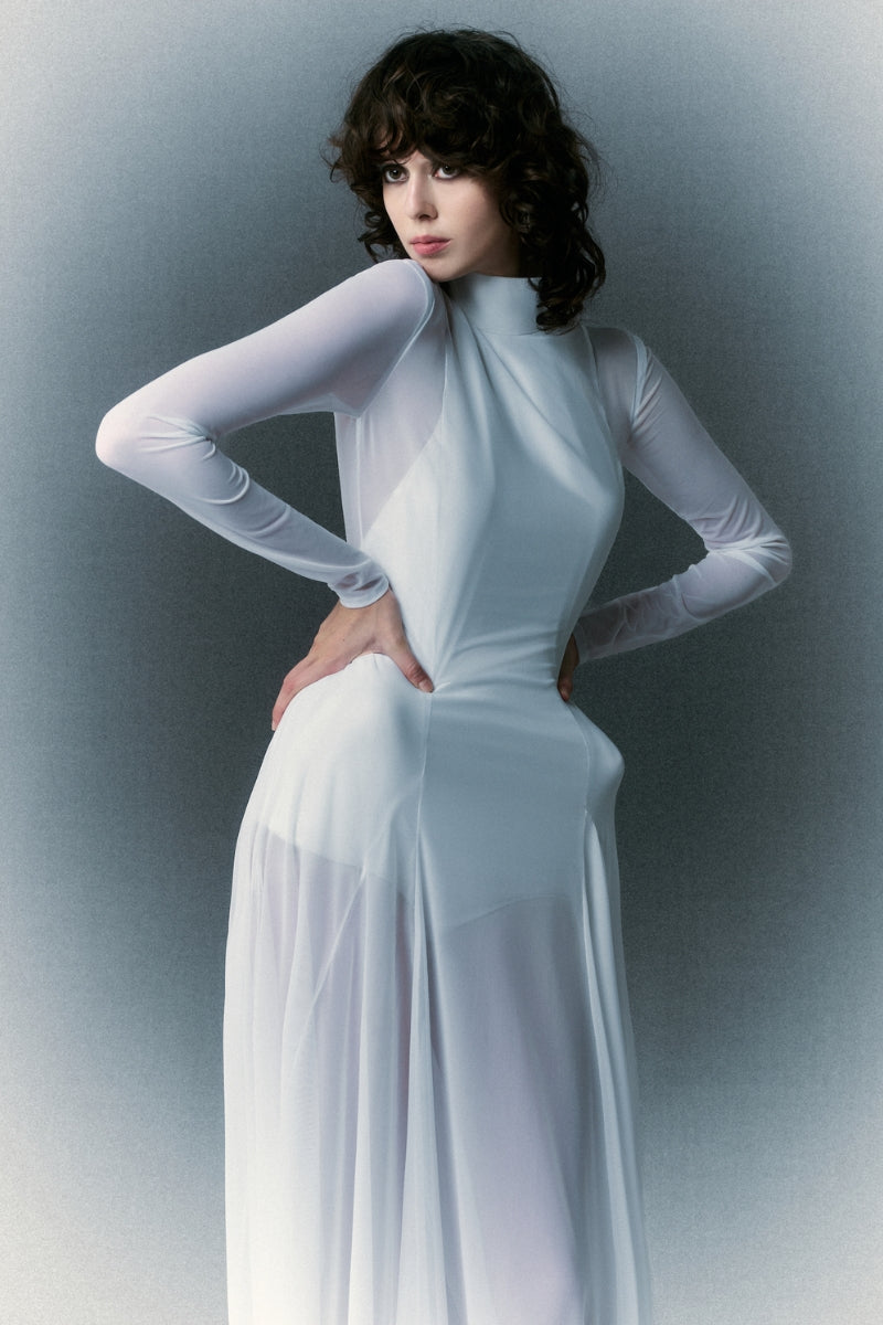 White Plan Nirvana Dress gown with elegant flowing fabric and subtle detailing, perfect for formal occasions.