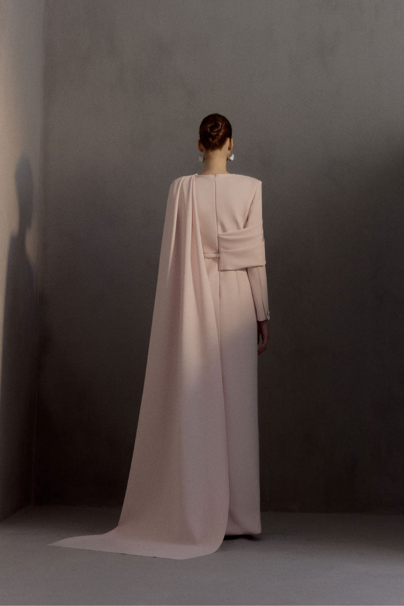 White Plan Miranda gown featuring elegant fabric and flowing design, perfect for formal occasions.