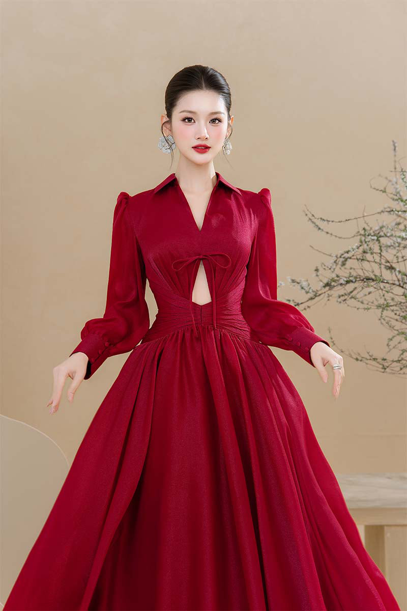 Do Long Scarlet Serenity Maxi Dress featuring flowing fabric and vibrant red color, displayed on a hanger.