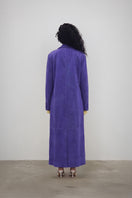 Deme By Gabriella HOSHI jacket, stylish coat with a modern design, shown in a natural outdoor setting.