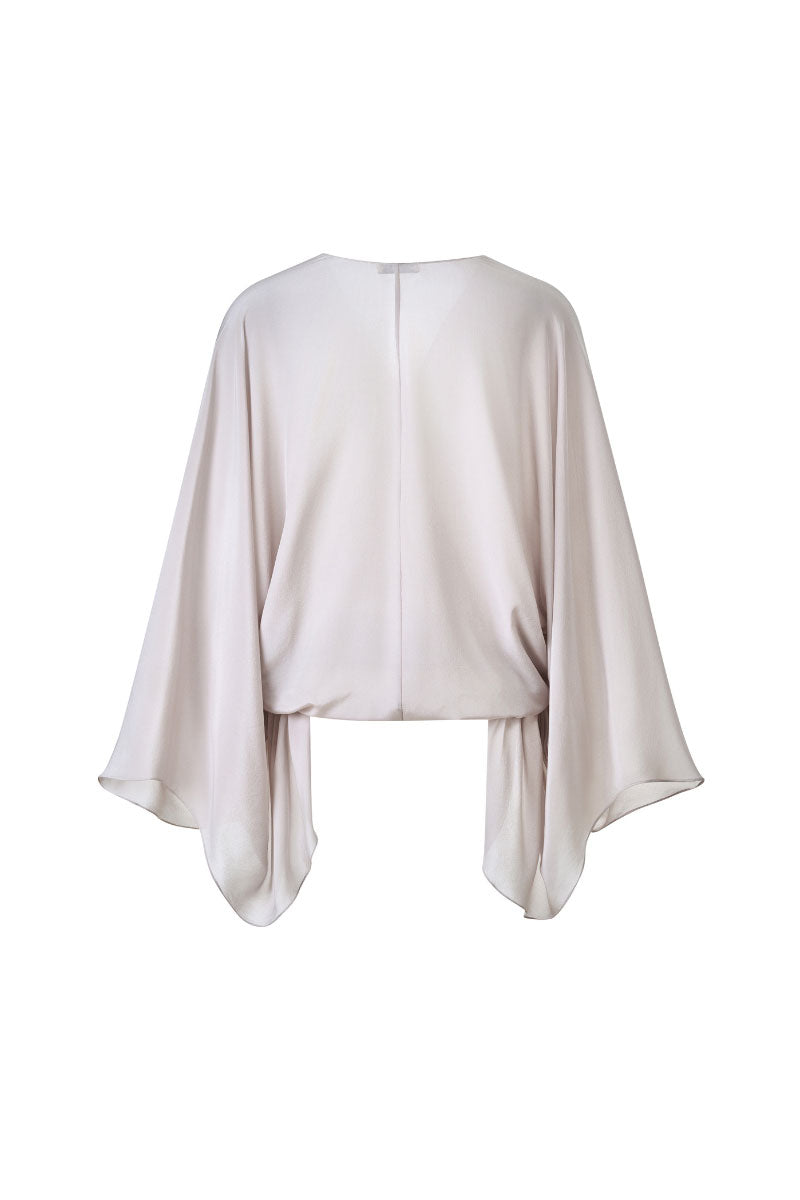 Light ivory long sleeve shirt by Lecia, featuring a soft fabric and classic fit, displayed on a hanger against a neutral background.