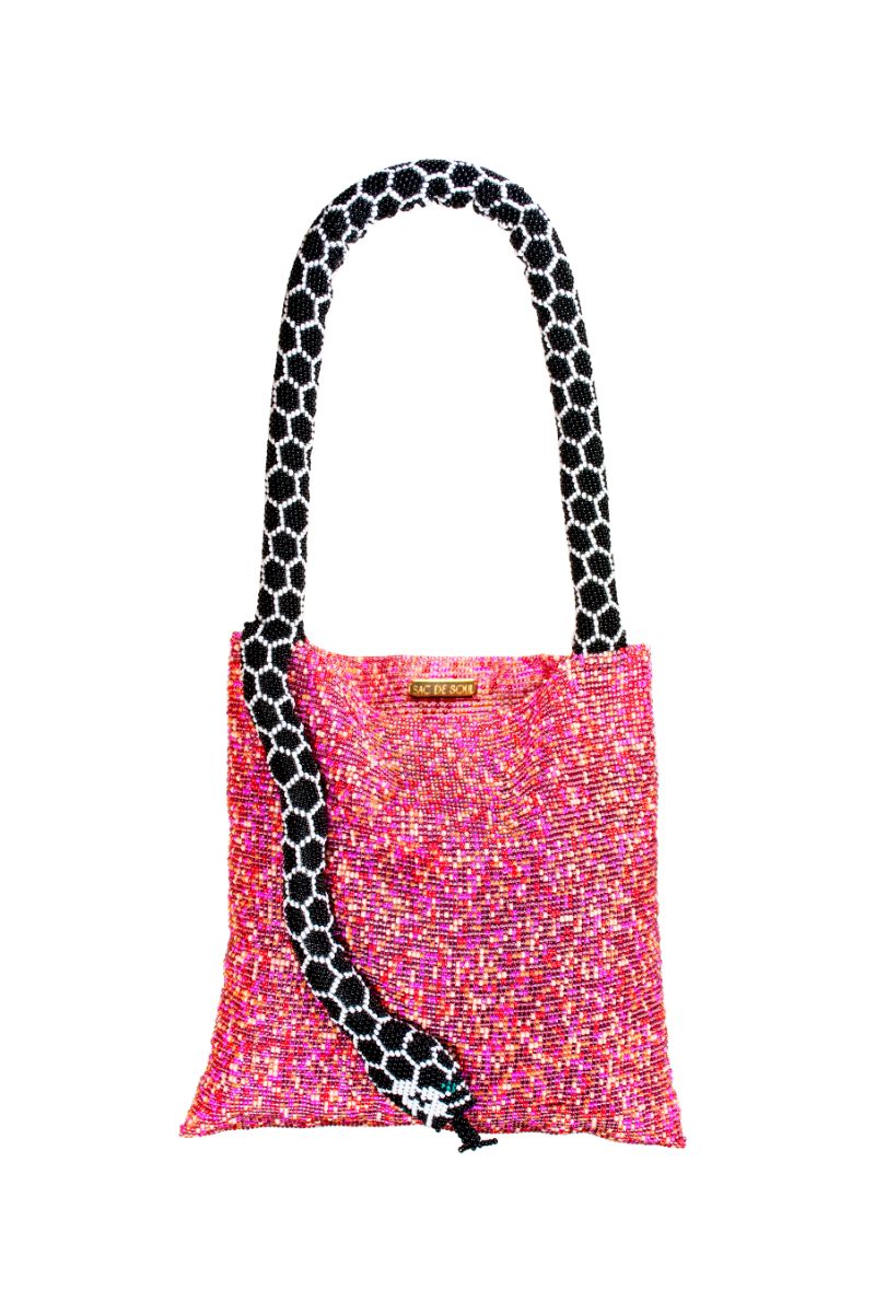 Pink Serpent Small Shoulder Bag by SAC DE SOUL with black and white accents, featuring a sleek, stylish design.