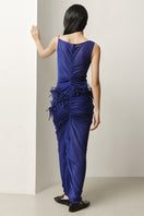 Lecia draped pom-pom sheer maxi dress with flowing fabric and decorative pom-pom accents, perfect for elegant summer occasions.