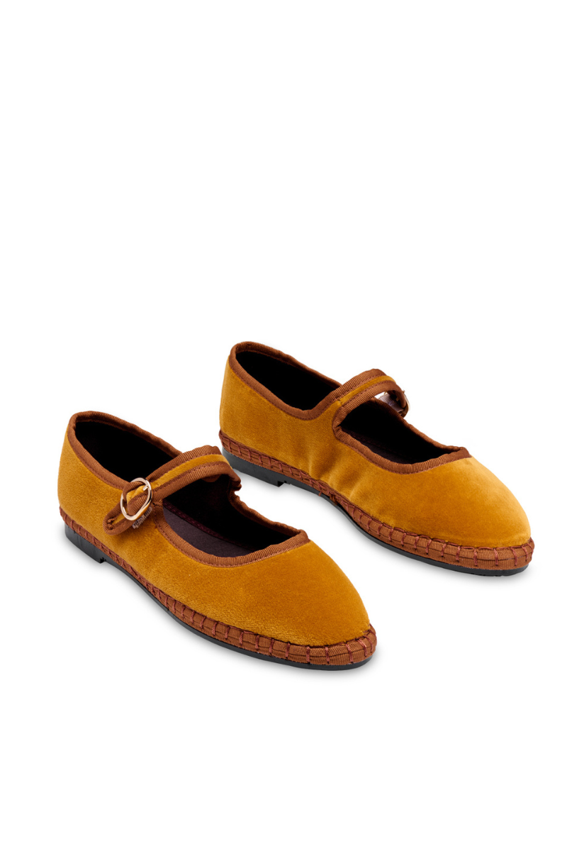 Flabelus Amaranta mustard flats with light brown piping, stylish and comfortable women’s slip-on footwear on a white background.