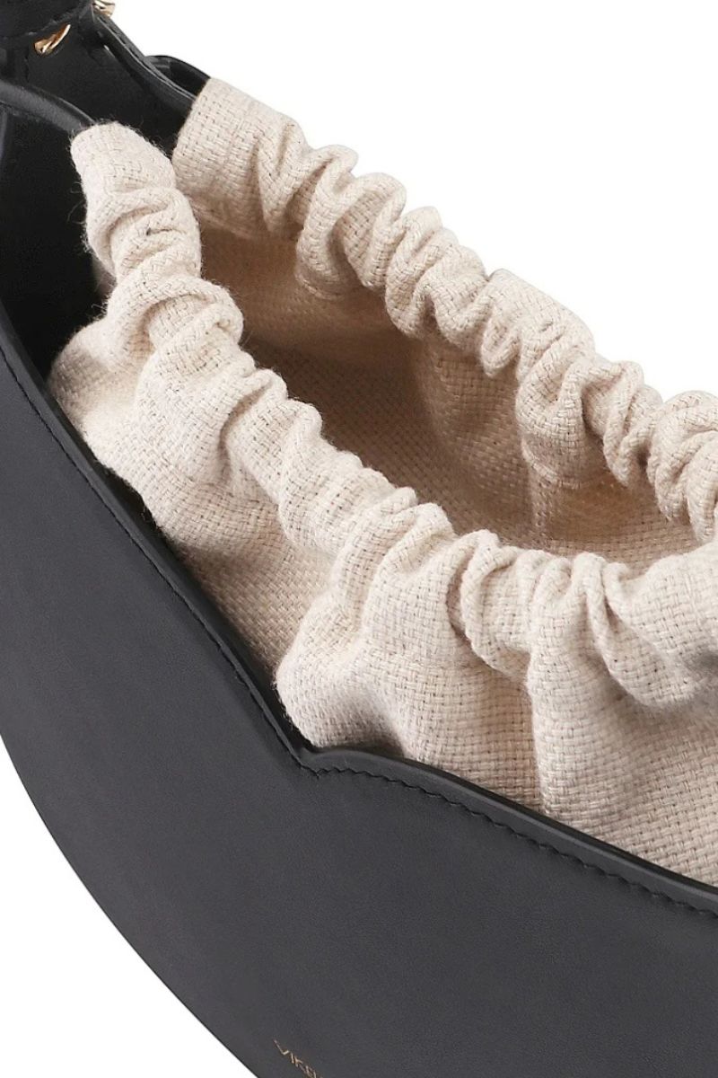 Black Maria mini top handle bag by Vikele Studio with sleek design and compact size, perfect for stylish everyday use.