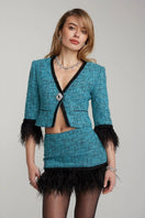 Nana Jacqueline Daphne blue tweed mini skirt with feather trim, featuring a fitted waist and stylish design.