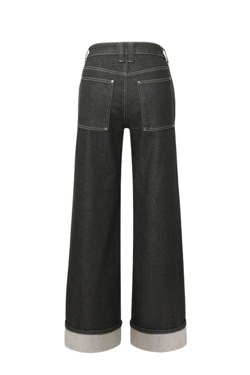 Dark wash Kendall jeans by TT Studios, slim fit denim with classic five-pocket design and subtle stitching details.