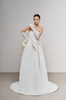 White Plan Leejie maxi dress featuring a flowing silhouette and elegant design, perfect for summer or special occasions.