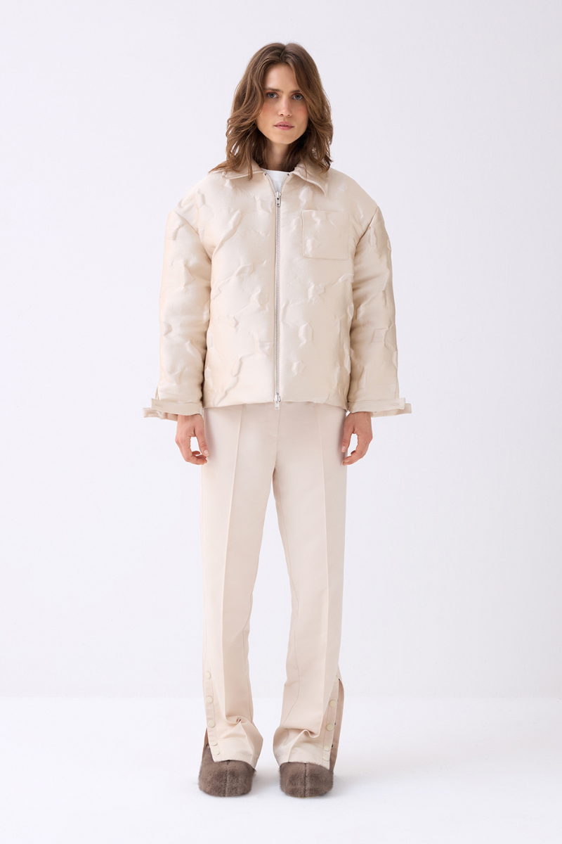 Cream-colored ColoReve sweat pants laid flat, showing their relaxed fit and soft fabric.